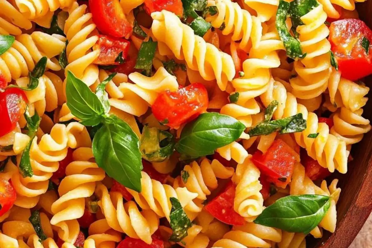 What are the five mistakes to avoid pasta salad? 1 "A vibrant pasta salad with fusilli, vegetables, and fresh herbs, demonstrating the perfect texture and color balance."