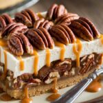 Pecan Pie Cheesecake Delight 7 Pecan Pie Cheesecake Delight with caramelized pecan topping and creamy cheesecake layer