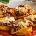 Cheesesteak Tortellini Delight 7 A creamy bowl of Cheesesteak Tortellini Delight featuring tender beef, colorful bell peppers, and cheese-filled tortellini.