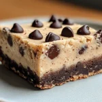 Chocolate Chip Cookie Dough Bars 7 No-bake chocolate chip cookie dough bars with a smooth chocolate topping. Perfect for dessert lovers.