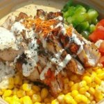Street Corn Chicken Rice Bowl 7 Street Corn Chicken Rice Bowl with grilled chicken, cilantro-lime rice, corn, avocado, and chili-lime crema.