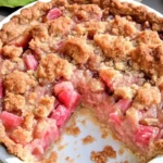 Rhubarb Sour Cream Pie 7 Homemade rhubarb sour cream pie with a golden crust and creamy filling, topped with a crunchy streusel.