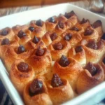 Cheesecake Crescent Rolls Casserole 7 Cheesecake Crescent Rolls Casserole with cinnamon-sugar topping in a baking dish