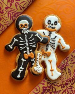 Spooky skeleton gingerbread cookies decorated with white icing bones for Halloween