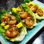 Close-up of delicious Avocado Mango Shrimp Lettuce Wraps served on a plate.