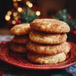 A stack of freshly baked Brown Butter Snickerdoodle Christmas Cookies on a red plate.