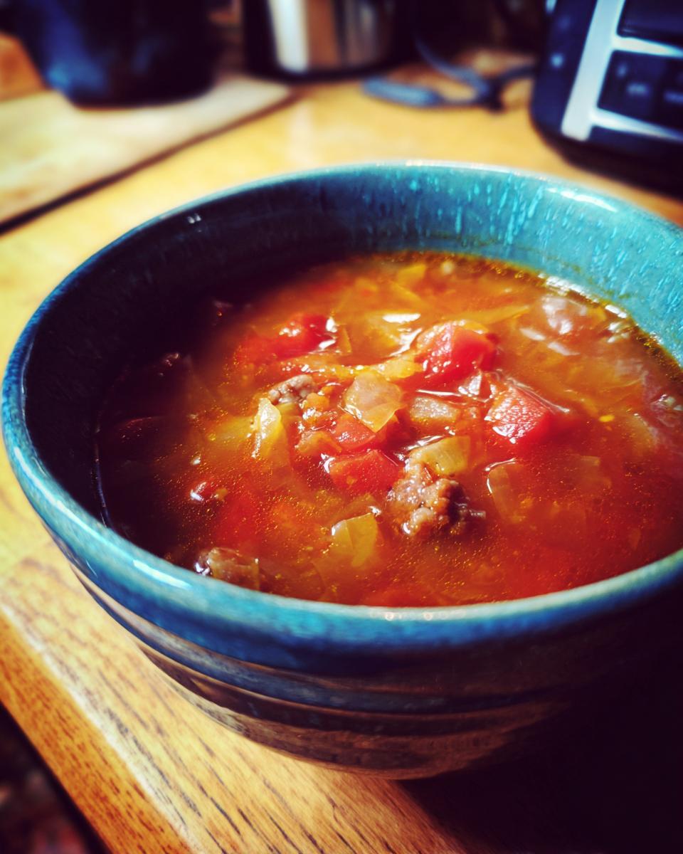 Bowl of Keto Cabbage & Sausage Soup, a low-carb and delicious soup.
