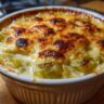Close-up of a freshly baked Leek Gratin with a golden, bubbly cheese topping.