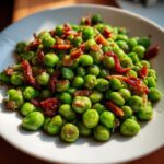 Close-up of a plate of delicious Peas with Pancetta, a quick and easy recipe.