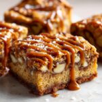 Close-up of Salted Caramel Pretzel Blondies drizzled with caramel and sprinkled with sea salt.