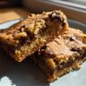 Close-up of two chocolate chip bars, showing the texture and chocolate filling. These Bars Are Better Than Brownies.