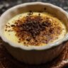 Close-up of a creamy dessert, crème brûlée, with a caramelized sugar crust and chocolate.