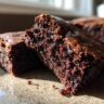 Close-up of a cut brownie showing a rich and fudgy texture. This is a Rich, Fudgy, and Completely Irresistible brownie.