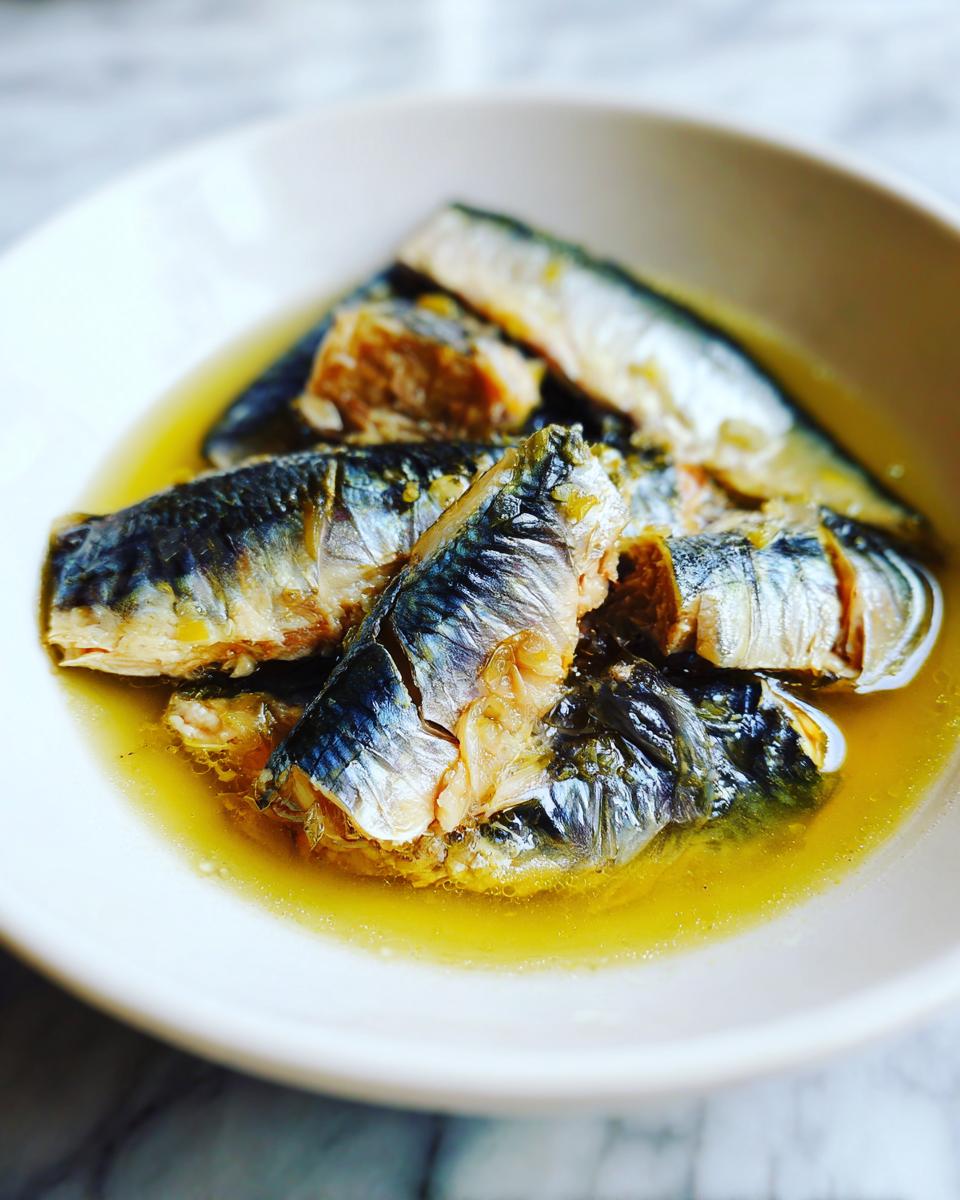 Amazing Fresh Sardine Cat Dinner: 1 Happy Cat 8 Close-up of fresh sardines in a bowl, ready for a Fresh Sardine Cat Dinner.