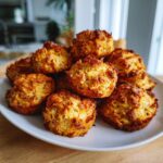 Amazing Grain-Free Cat Treats: 1 Delicious Recipe 11 A pile of golden-brown Grain-Free Cat Treats on a white plate, ready to be enjoyed.