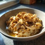 Amazing High-Calorie Cat Recovery Meal 11 A bowl of High-Calorie Cat Recovery Meal with shredded chicken and rice.