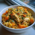 Close-up of a bowl filled with a homemade Indoor Cat Weight Control Meal, with chicken and vegetables.