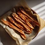 Amazing Salmon Skin Cat Treats: 1 Ingredient Joy 11 Overhead shot of homemade salmon skin cat treats on parchment paper, the perfect salmon skin cat treats.