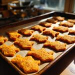 Amazing Salmon & Sweet Potato Cat Treats 11 Close-up of freshly baked Salmon & Sweet Potato Cat Treats on a baking sheet.