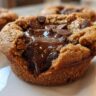 Close-up of an Ultimate Gooey Cookie Cup filled with melted chocolate and chocolate chips.