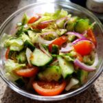 18 Best 15-Minute Salad Recipes: Deliciously Fast 11 Close-up of a fresh salad with tomatoes, cucumbers, red onion, and lettuce; perfect for a 15-Minute Salad.