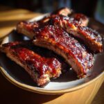 Close-up of BBQ Ribs with Homemade Sauce, glistening and delicious.