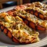 Close-up of grilled lobster tails with garlic butter, a delicious seafood dish. Featuring the primary keyword: Grilled Lobster Tails with Garlic Butter.