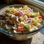 Perfect Pasta Salad Classic: 5 Easy Steps 11 Close-up of a bowl of pasta salad classic with rotini pasta, vegetables, and creamy dressing.