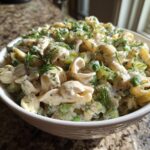 Amazing Pasta Salad Dill Pickle: 1 Delicious Bite 11 Close-up of a bowl of pasta salad dill pickle with pasta, dill, and creamy dressing.