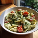 Amazing pasta salad green goddess: 1 fresh recipe 11 Close-up of a bowl of pasta salad green goddess with cherry tomatoes and fresh herbs.