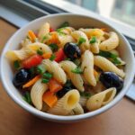 Amazing Pasta Salad No Cheese: 1 Delicious Recipe 11 A bowl of delicious pasta salad no cheese with olives, tomatoes, and vegetables.