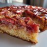 Close-up of a slice of Rhubarb Upside Down Cake, showing the rhubarb topping and cake base.