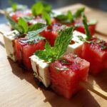 Close-up of refreshing Watermelon Feta Skewers with mint and balsamic glaze, perfect for a summer snack.